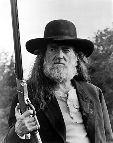 Willie Nelson holding a shotgun photo print