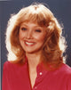 Close-up portrait photo print of Shelley Long in a red tunic