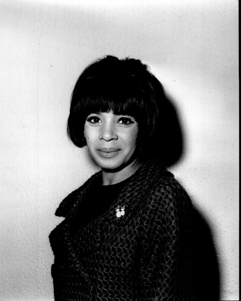 Black and white photo print of Shirley Bassey in coat, iconic music legend.