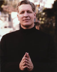 Clancy Brown portrait photo print in praying pose wearing a black sweater.