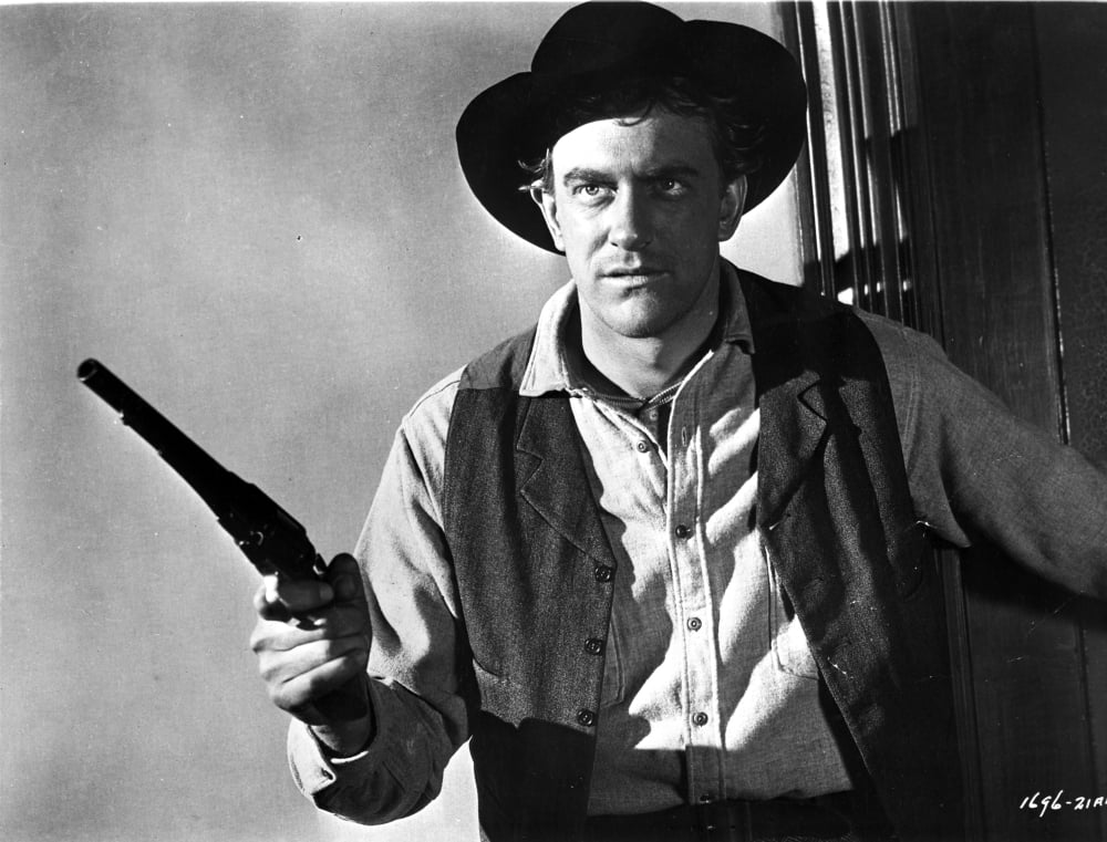 James Arness cowboy photo print carrying a gun in classic film still.