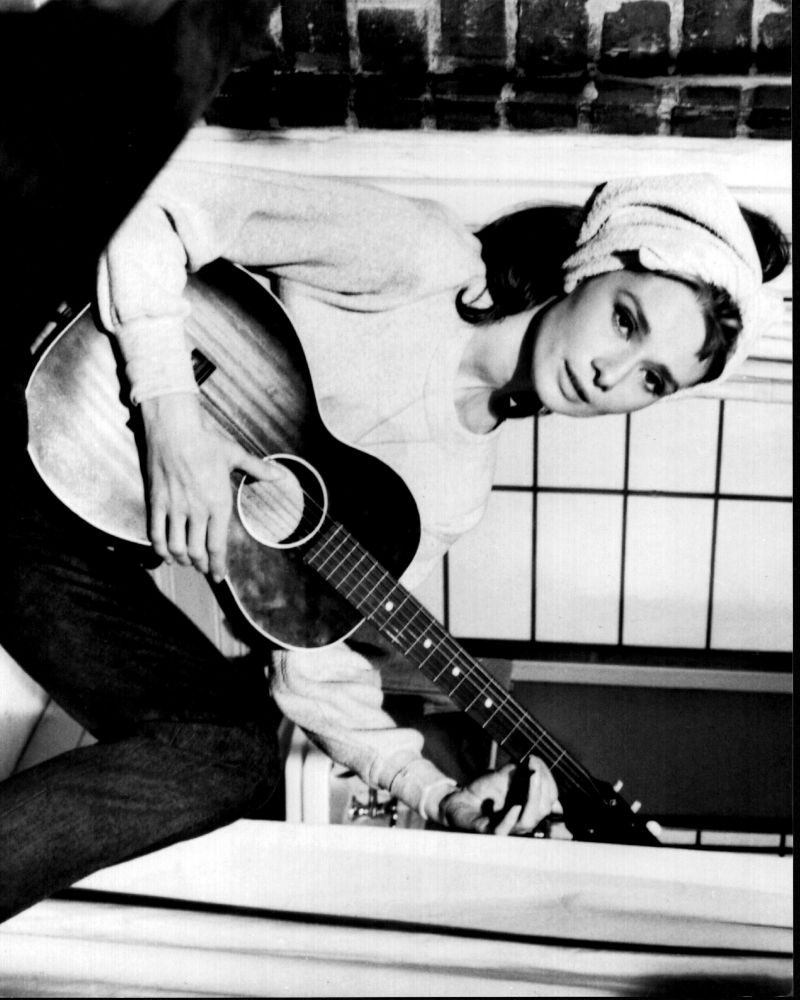 Audrey Hepburn playing guitar on a windowsill - Breakfast at Tiffany's black and white photo print