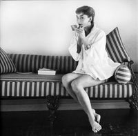 Audrey Hepburn couch photo print in multiple sizes.
