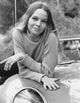 Michelle Phillips Leaning on Car Photo Print, available in multiple sizes.