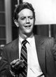 Judge Reinhold gesturing in a photo print
