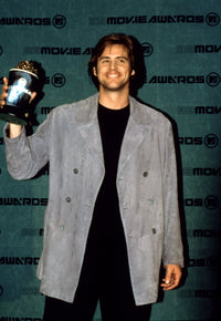 Jim Carrey holding his MTV Movie Award trophy poster print.