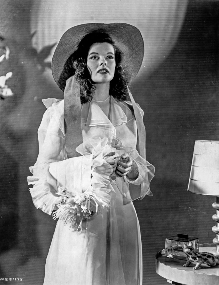 Katharine Hepburn posed in a white dress with hat photo print