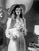 Katharine Hepburn posed in a white dress with hat photo print
