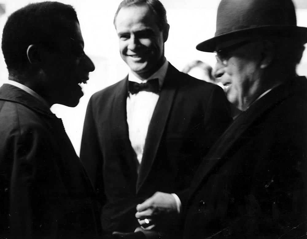 Photo print of Marlon Brando, James Baldwin, and Charlie Chaplin.