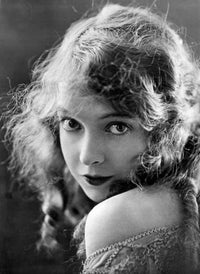 Lillian Gish portrait photo print in off-shoulder top with chin on shoulder.