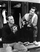 Pat Boone playing guitar in a locker room film still photo print.
