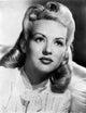 Betty Grable portrait photo print in silk lace scarf and white silk dress.