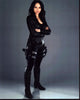 Melissa O'Neil Dark Matter photo print featuring a character in a black outfit with thigh gun holsters.