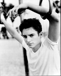 Elijah Wood hanging on jungle gym black and white photo print