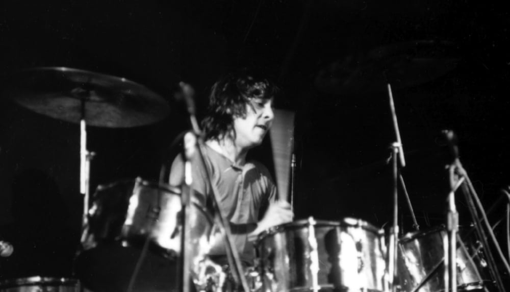 Keith Moon playing the drums photo print showcasing rock history.
