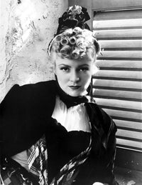 Claire Trevor posed elegantly in a black dress photo print.