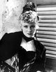 Claire Trevor posed elegantly in a black dress photo print.