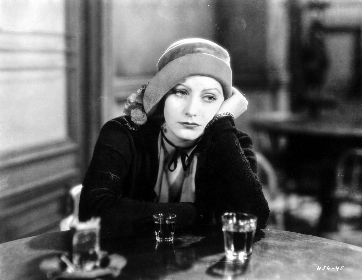 Vintage photo print of Greta Garbo leaning at the bar.