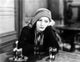 Vintage photo print of Greta Garbo leaning at the bar.
