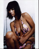 Bai Ling pulling on a pink and brown bikini photo print