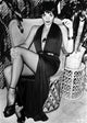Liza Minnelli seated in a classic photo print, available in multiple sizes.