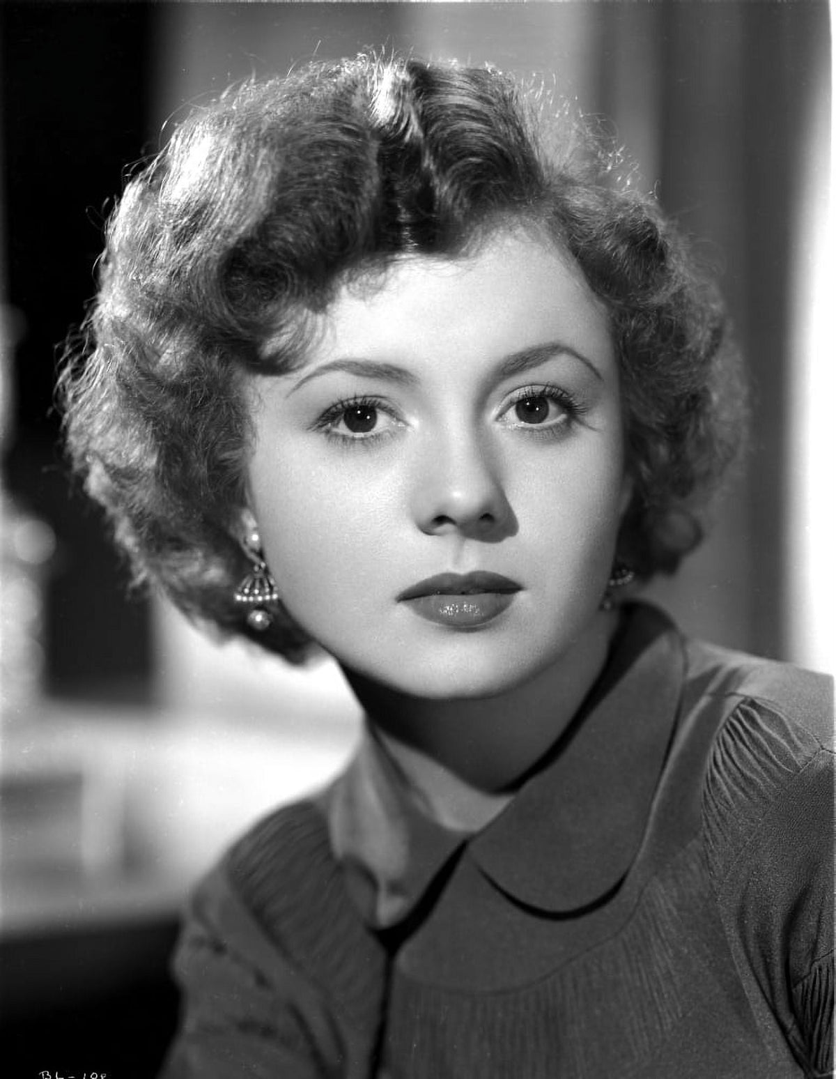 Betty Lynn sitting portrait photo print showcasing classic Hollywood charm.