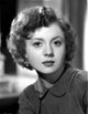 Betty Lynn sitting portrait photo print showcasing classic Hollywood charm.