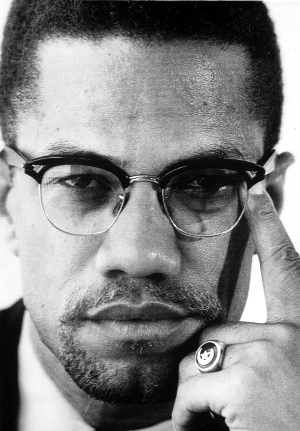 Close-up photo print of Malcolm X, iconic civil rights leader.