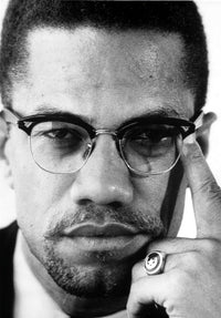 Close-up photo print of Malcolm X, iconic civil rights leader.