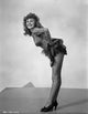 Rita Hayworth bending over in heels vintage photo print