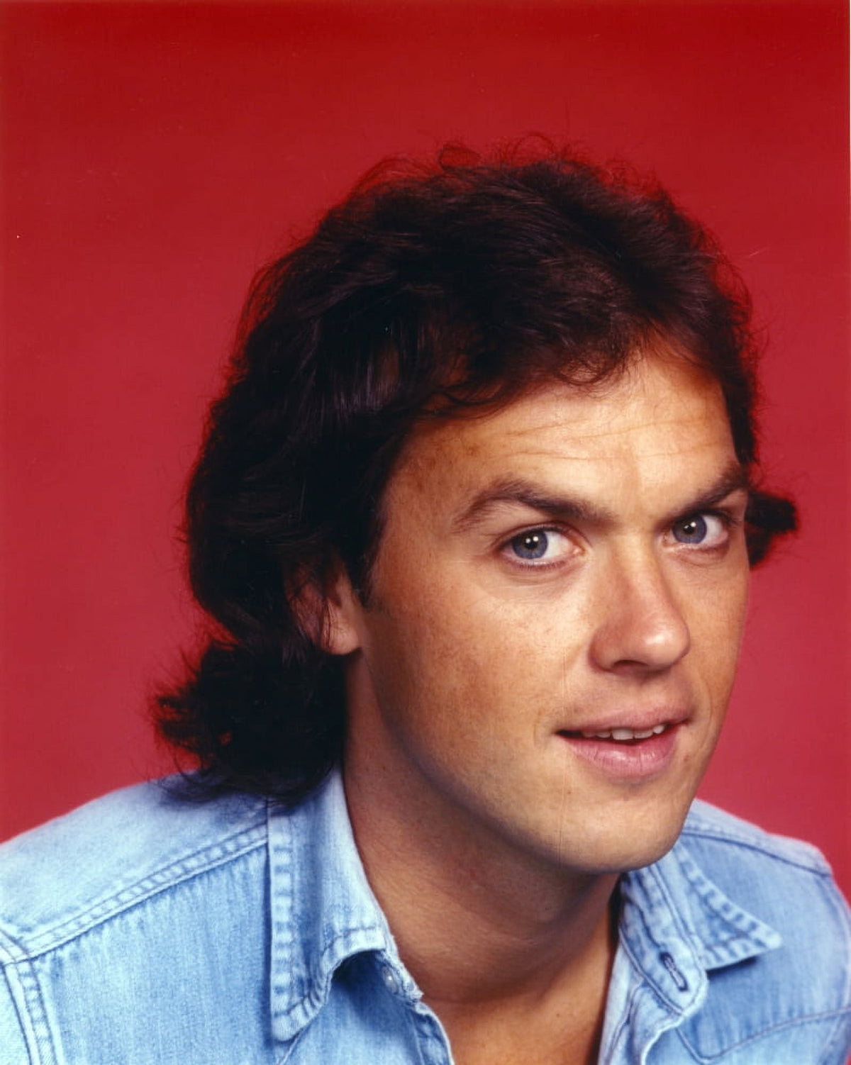 Close-up portrait of Michael Keaton wearing a blue denim jacket photo print.