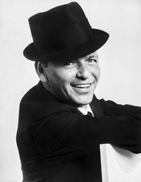 Frank Sinatra smiling photo print in suit and black hat.