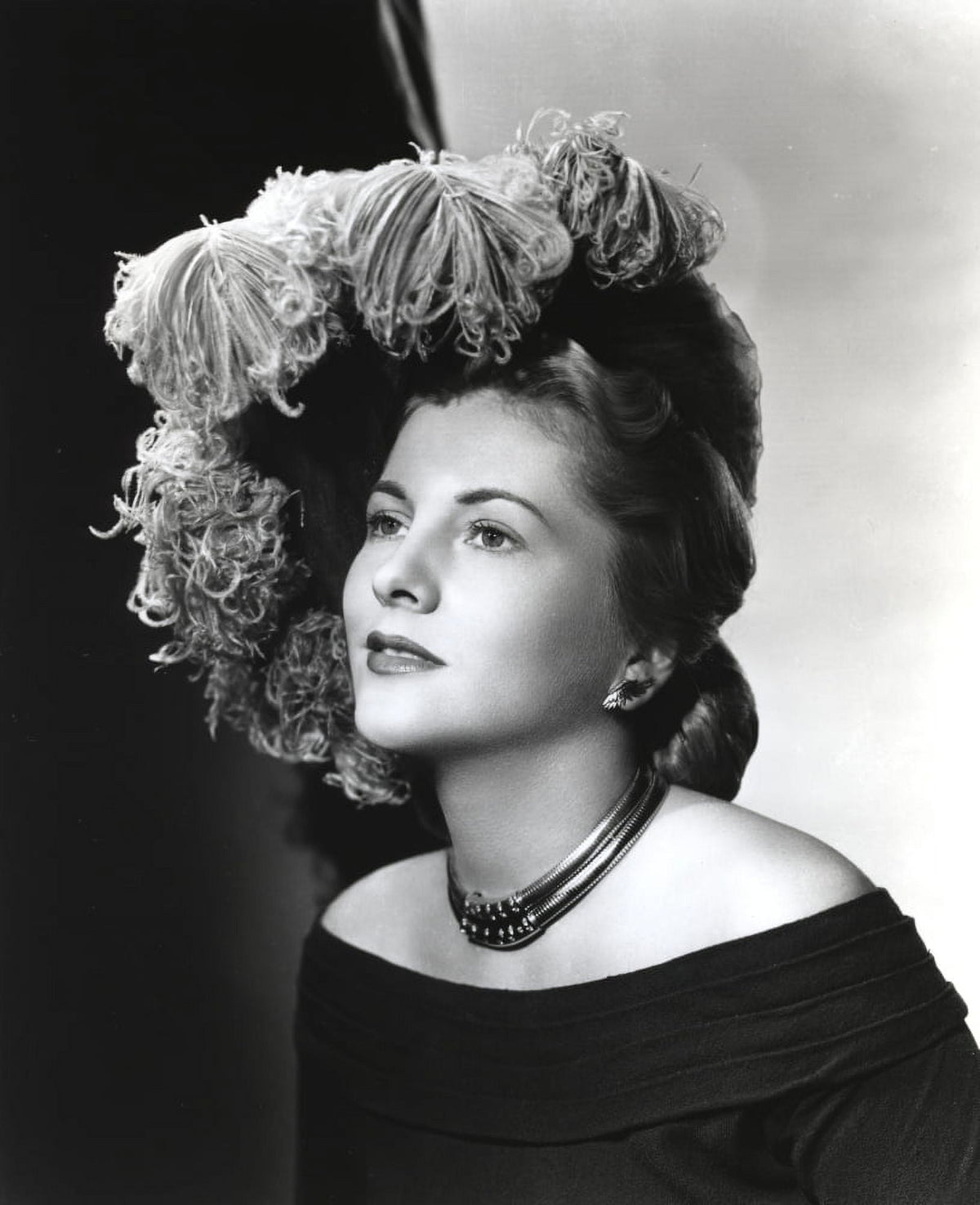 Joan Fontaine photo print in a sideway pose, showcasing classic Hollywood elegance.