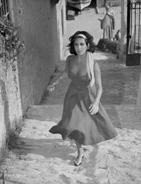 Elizabeth Taylor running in a dress with headband photo print.