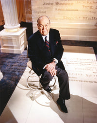 Charles Kuralt in formal suit sitting on chair photo print.