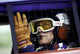 Paul Newman wearing a helmet and goggles in a racing car photo print.