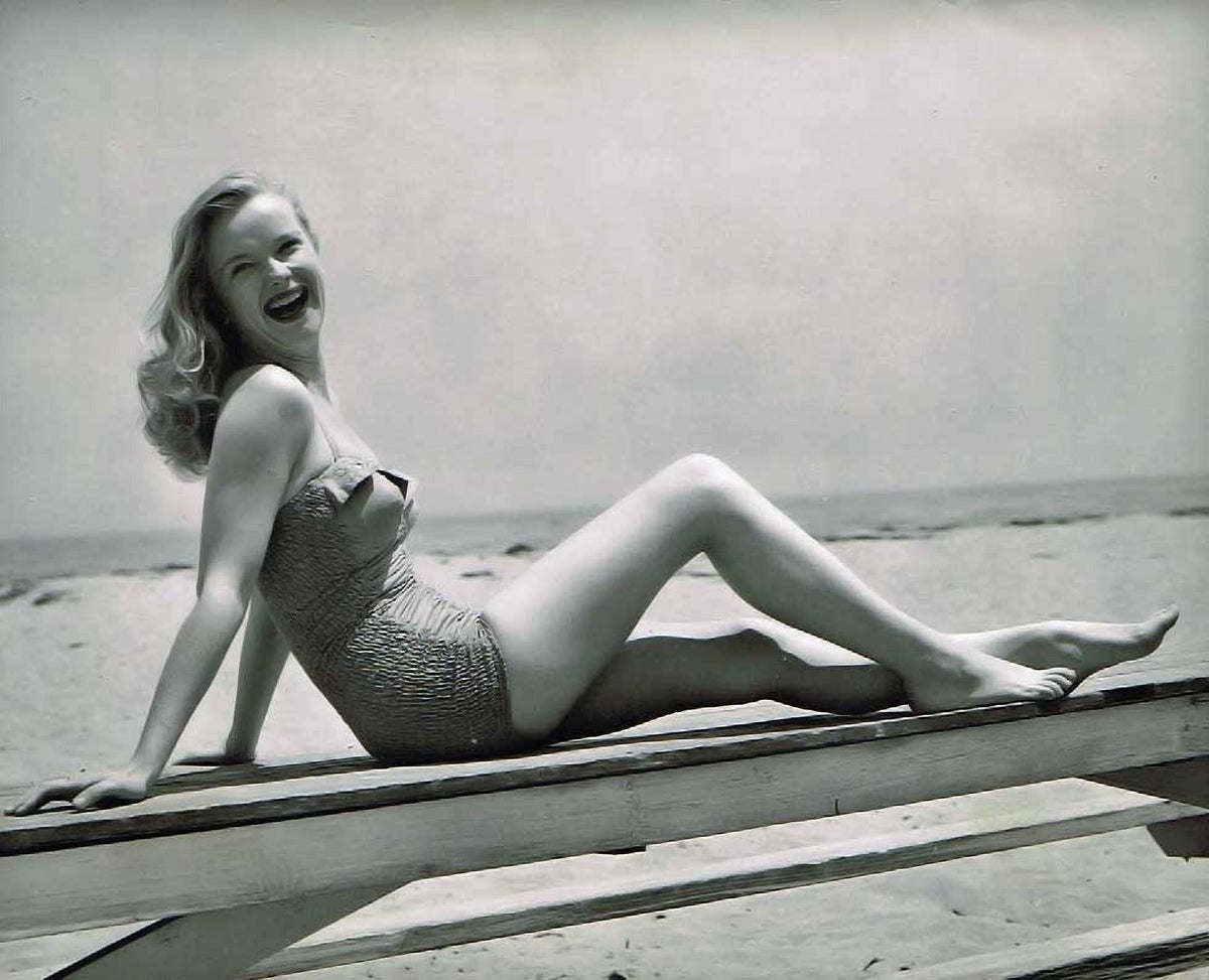 Anne Francis Sitting on Table Photo Print in 8x10, 16x20, 24x30 sizes.