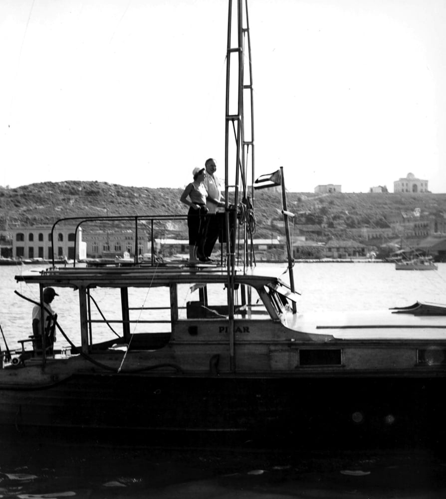 Ernest Hemingway on a boat photo print capturing adventure.