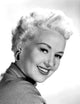 Betty Grable 1954 Photo Print showcasing classic Hollywood glamour.