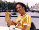 Rob Schneider portrait photo print in yellow shirt, available in multiple sizes.