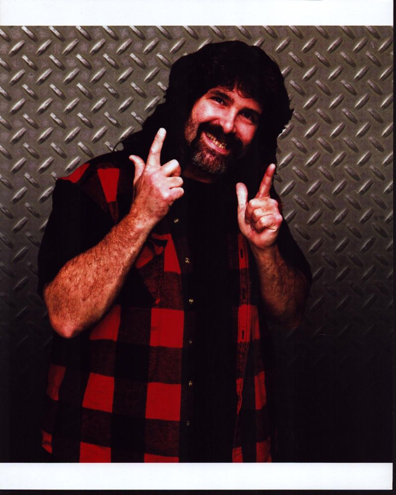 Mick Foley in red plaid shirt photo print against metal wall