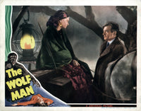 The Wolf Man movie poster featuring Maria Ouspenskaya and Claude Rains, classic horror film art.