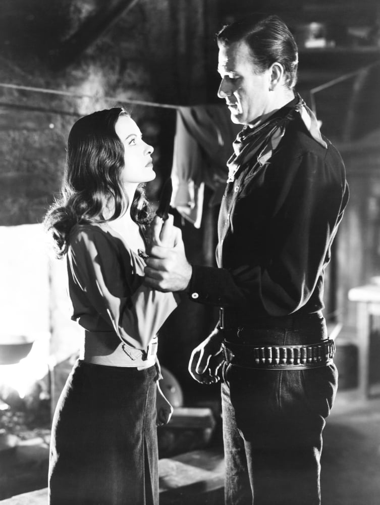 Tall in The Saddle photo print featuring John Wayne and Ella Raines from the classic 1944 film