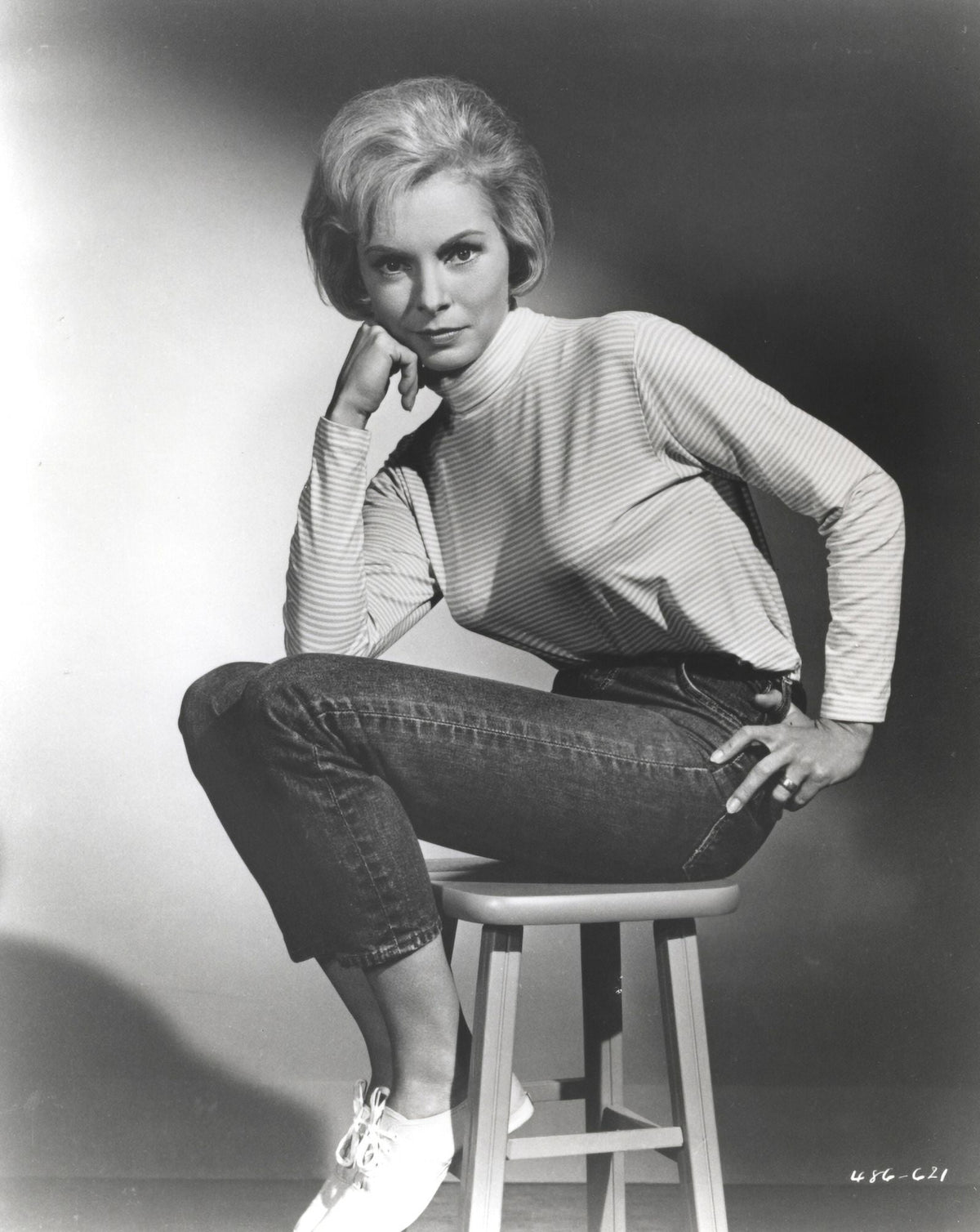 Janet Leigh seated in a white high neck linen dress photo print