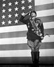 George C. Scott saluting in front of American flag photo print