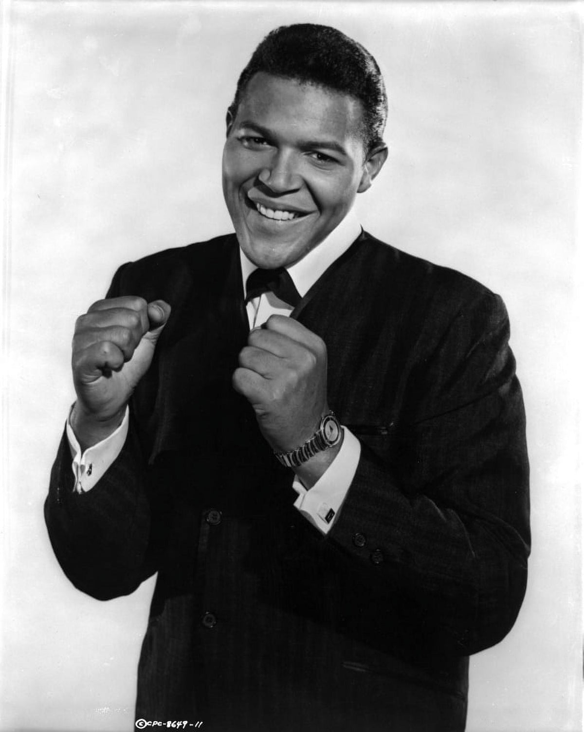 Chubby Checker smiling photo print showcasing classic music culture.