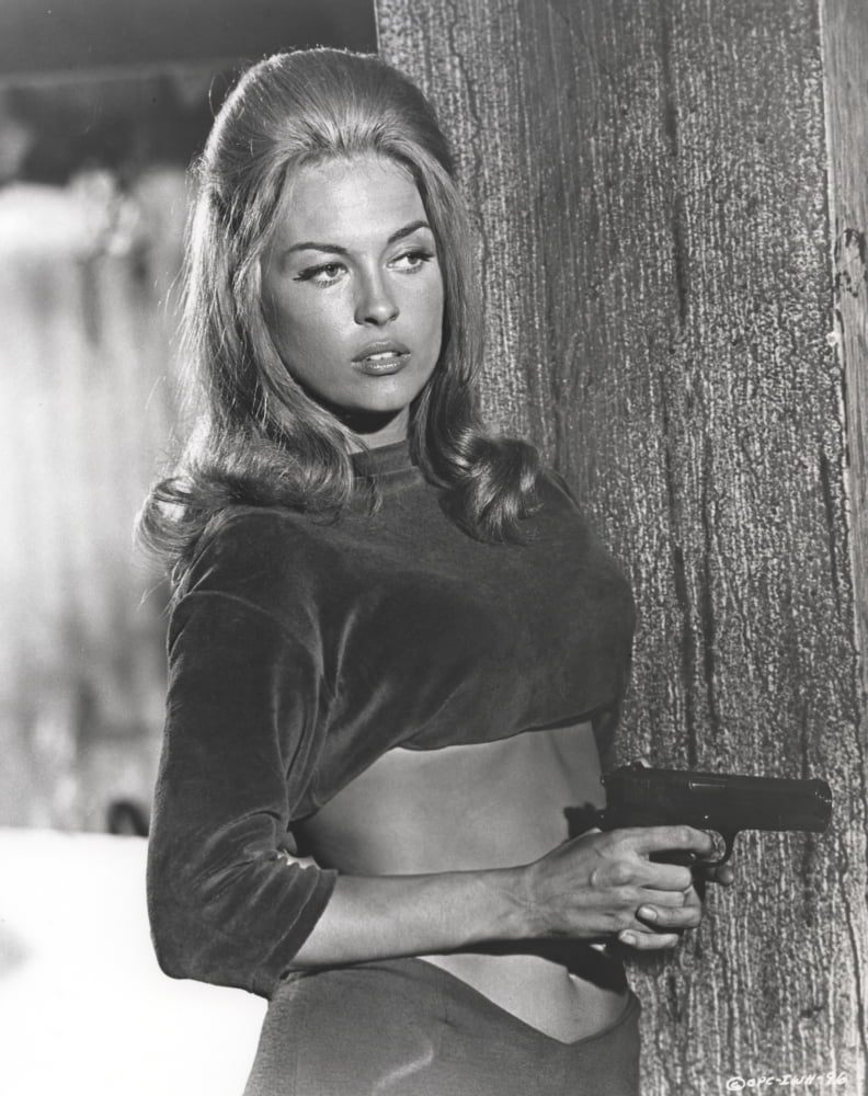 Faye Dunaway holding a pistol in classic photo print.