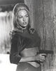 Faye Dunaway holding a pistol in classic photo print.