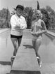 Bing Crosby photo print featuring him with a woman in jogging wear.