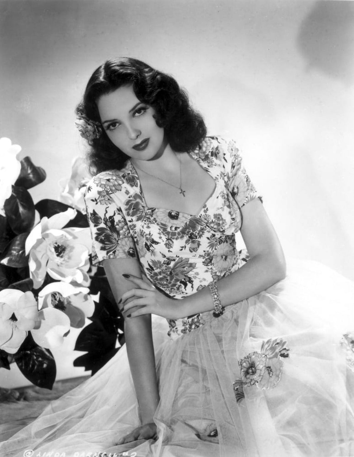 Black and white photo print of Linda Darnell wearing a floral dress.